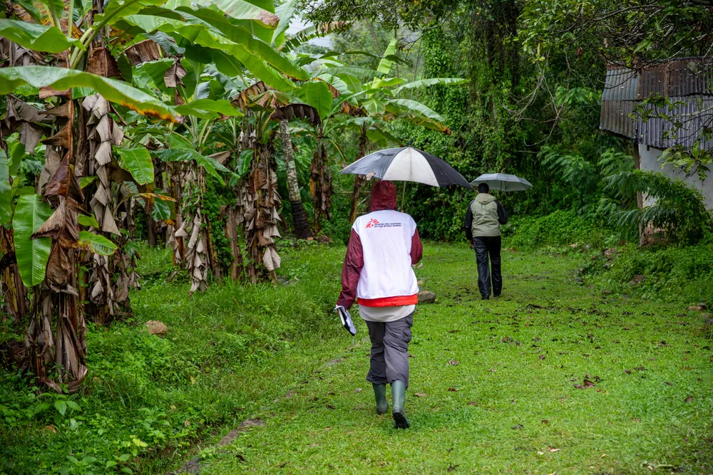 The team is assessing the logistics of bringing a water supply to the safety centre from the nearest water source. Badulla district, Uva Province, Sri Lanka.
