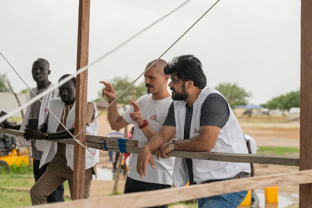 MSF Staff inspecting the water purification plant