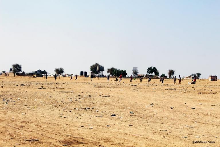 Playing football in IDP camp in Pulka