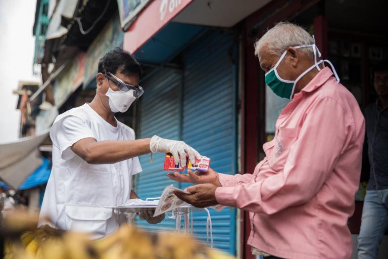 MSF staff Ganpat distributing Essentials .jpg