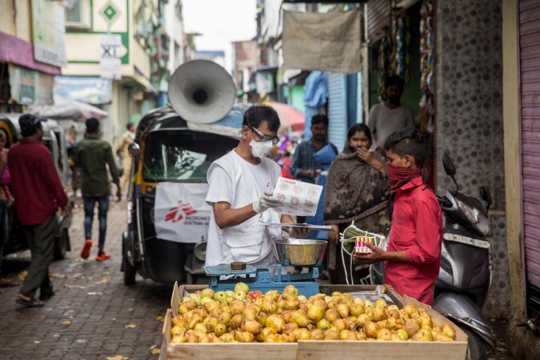 MSF staff Ganpat distributing soap and masks to hawkers on the street 1.jpg