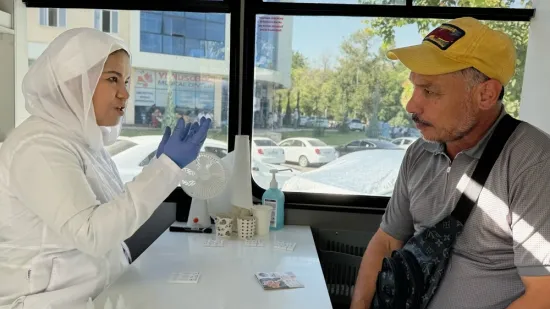 Dr. Abidova talks to a client