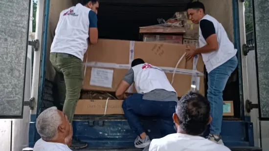 MSF teams loading medical supplies and trauma kits