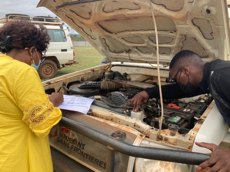 Fikile checks her vehicle