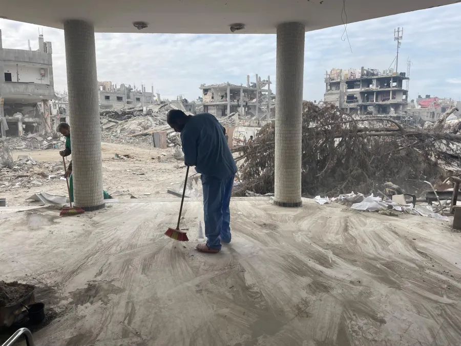 Man cleaning the rubble inside the Emirati hospital in Rafah city, southern Gaza, Palestine.