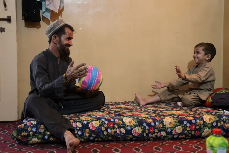 Mustafa playing with his father