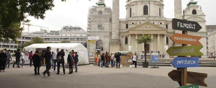 Die Ausstellung "Hilfe aus nächster Nähe" von Ärzte ohne Grenzen am Karlsplatz in Wien. Von 25.9. bis 6.10.2014.