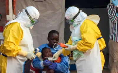 Jariatu, an MSF 'care-giver' looking after a 9mo baby